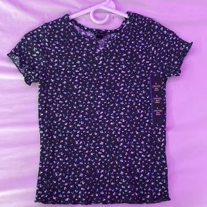 Black shirt with pink, blue, and white flowers